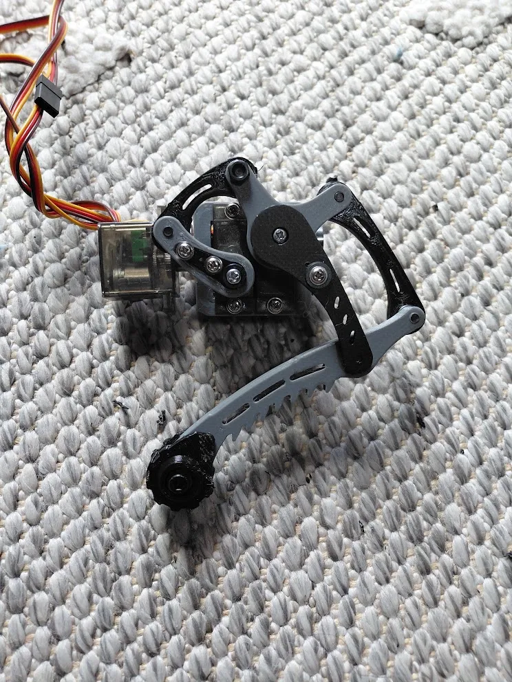 A physical leg mechanism photographed from another angle before the later body revisions.
