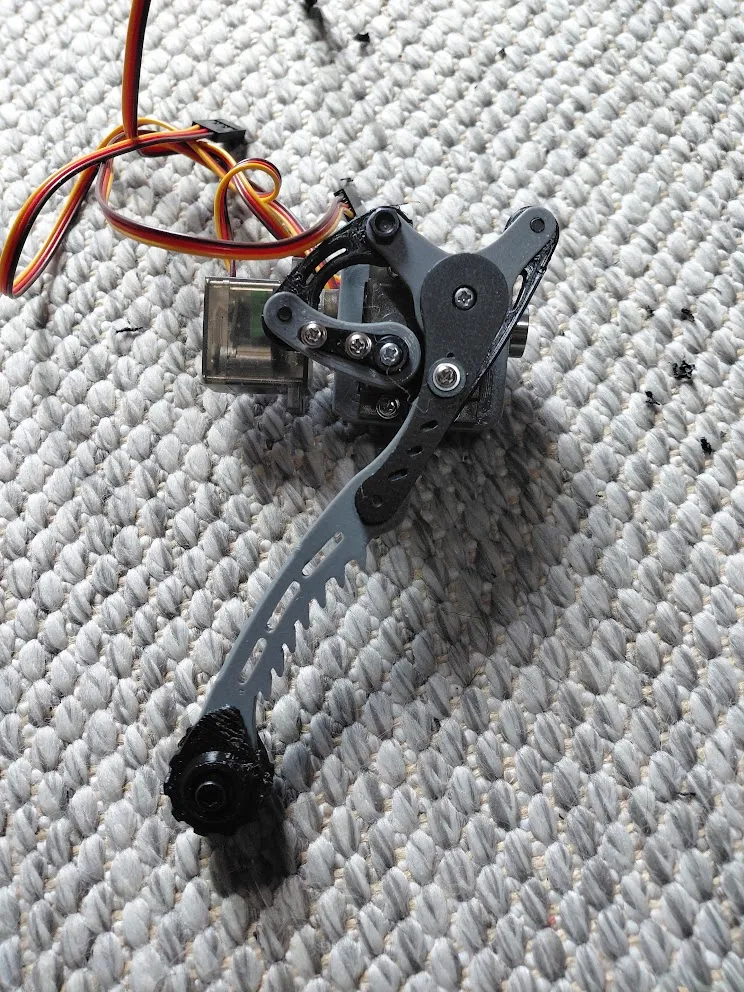 A physical leg mechanism photographed from another angle before the later body revisions.