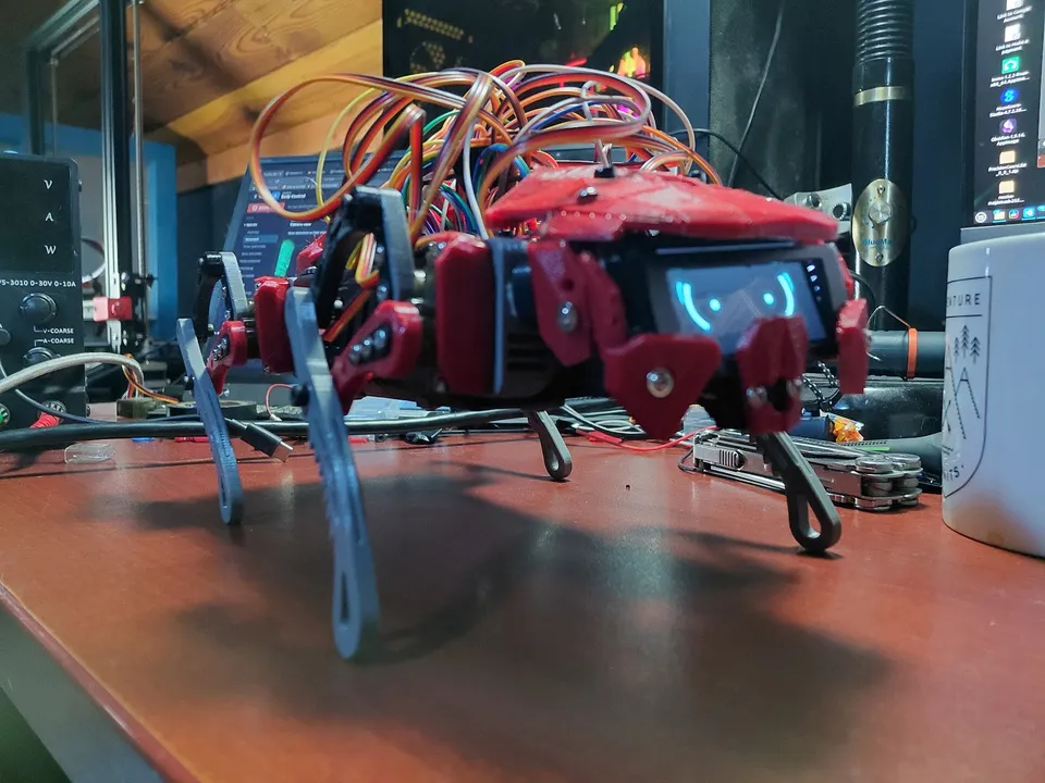 The assembled V2 prototype on the October 21 workbench, with its red face surround, illuminated display and exposed upper wiring.